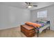 Simple bedroom with wood floors and ceiling fan at 15950 Adobe Dr, Hudson, FL 34667