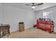 Bedroom currently used as a workspace with desk, filing cabinets, and storage at 15950 Adobe Dr, Hudson, FL 34667