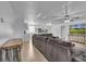 Open concept living room with view of kitchen and large sectional couch at 15950 Adobe Dr, Hudson, FL 34667