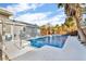 Private backyard inground pool with paved decking and fenced yard at 15950 Adobe Dr, Hudson, FL 34667