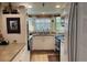 Cozy kitchen featuring white cabinets and wood-look floors at 21107 Fountain View Ln # 5304, Lutz, FL 33558