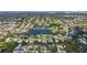 An aerial view of the neighborhood with a lake, golf course, and trees at 2118 Huntington Ave, Sarasota, FL 34232