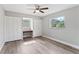 Bright bedroom with built-in closet, ceiling fan, and large window at 2118 Huntington Ave, Sarasota, FL 34232