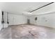 Spacious attached garage with ample storage space and high ceilings at 2118 Huntington Ave, Sarasota, FL 34232