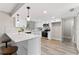Updated kitchen featuring white cabinetry, quartz countertops, and stainless steel appliances at 2118 Huntington Ave, Sarasota, FL 34232