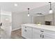 View of the sleek, modern white kitchen with quartz countertops at 2118 Huntington Ave, Sarasota, FL 34232