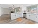 Bright white kitchen with new appliances, quartz countertops, and ample storage at 2118 Huntington Ave, Sarasota, FL 34232