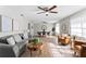 Inviting living room with modern furnishings, wood-look flooring, and ceiling fans at 2118 Huntington Ave, Sarasota, FL 34232