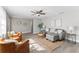 Living area featuring plush seating, ceiling fans, modern decor, and ample natural light at 2118 Huntington Ave, Sarasota, FL 34232