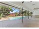 Covered patio area by the screened-in pool at 2118 Huntington Ave, Sarasota, FL 34232