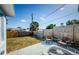 Spacious fenced backyard with a patio area and well-maintained lawn, perfect for outdoor gatherings at 3444 Clydesdale Dr, Holiday, FL 34691