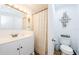 Well-maintained bathroom featuring a vanity and a decorative mirror at 3444 Clydesdale Dr, Holiday, FL 34691