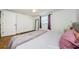 Bedroom with a window, hardwood floors, and a queen size bed at 3444 Clydesdale Dr, Holiday, FL 34691