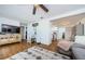 Cozy living room with an area rug, hardwood floors, and access to the kitchen at 3444 Clydesdale Dr, Holiday, FL 34691