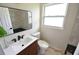 Modern bathroom with a floating vanity, stylish tile work, and updated fixtures at 3606 River Grove Dr, Tampa, FL 33610