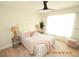 Bright bedroom with plush bedding, ample natural light, and a ceiling fan at 3606 River Grove Dr, Tampa, FL 33610