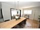 Modern dining room with a long wooden table and chairs at 3606 River Grove Dr, Tampa, FL 33610