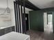 Bright hallway with dark green accent wall at 3606 River Grove Dr, Tampa, FL 33610