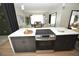 Modern kitchen features a large island with cooktop and oven, and plenty of cabinet space at 3606 River Grove Dr, Tampa, FL 33610