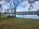 Peaceful lake view with dock in the distance at 3606 River Grove Dr, Tampa, FL 33610