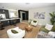 Open living room with modern kitchen and island at 3606 River Grove Dr, Tampa, FL 33610