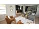 Spacious living area with open kitchen view and leather chairs at 3606 River Grove Dr, Tampa, FL 33610
