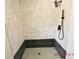 Contemporary walk-in shower with geometric patterned tile and modern fixtures at 3606 River Grove Dr, Tampa, FL 33610