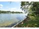 Peaceful waterfront view with calm waters and trees at 3606 River Grove Dr, Tampa, FL 33610
