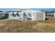 Backyard with shed, clothesline, and AC unit at 3844 Kim Dr, Wesley Chapel, FL 33543