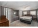 Bedroom with carpet, ceiling fan, and wooden furniture at 3844 Kim Dr, Wesley Chapel, FL 33543
