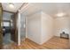 Hallway with wood-look flooring leading to various rooms at 3844 Kim Dr, Wesley Chapel, FL 33543