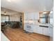 Bright kitchen featuring white cabinetry, essential appliances, and dining area at 3844 Kim Dr, Wesley Chapel, FL 33543
