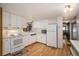 Kitchen with white cabinets, modern appliances, and ample counter space at 3844 Kim Dr, Wesley Chapel, FL 33543