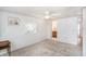 Spacious main bedroom with carpeted floors, ceiling fan, and ensuite bathroom access at 3844 Kim Dr, Wesley Chapel, FL 33543