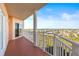 Spacious balcony offering scenic views of surrounding homes and greenery at 4516 Seagull Dr # 805, New Port Richey, FL 34652