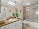 Well-appointed bathroom with a walk-in shower, single vanity, and neutral tile flooring at 4516 Seagull Dr # 805, New Port Richey, FL 34652