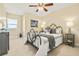 Bedroom with a decorative metal bed frame, soft carpeting, and tasteful furnishings at 4516 Seagull Dr # 805, New Port Richey, FL 34652