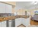 Kitchen featuring granite counters, white cabinets, and stainless steel appliances at 4516 Seagull Dr # 805, New Port Richey, FL 34652