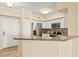 Kitchen with granite countertops, stainless steel appliances, and a breakfast bar at 4516 Seagull Dr # 805, New Port Richey, FL 34652