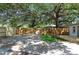 Spacious backyard with wooden fence, patio area, and deck at 4629 26Th S Ave, St Petersburg, FL 33711