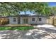 Backyard view with wooden deck, patio, and fenced-in yard at 4629 26Th S Ave, St Petersburg, FL 33711