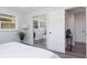 Bright bedroom with mirrored closet doors and gray floors at 4629 26Th S Ave, St Petersburg, FL 33711