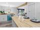Kitchen boasts butcher block island and white shaker cabinets at 4629 26Th S Ave, St Petersburg, FL 33711