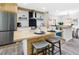 Modern kitchen with island seating, butcher block counters, and stainless steel appliances at 4629 26Th S Ave, St Petersburg, FL 33711