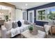 Bright living room with a blue accent wall and barn door at 4629 26Th S Ave, St Petersburg, FL 33711