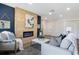 Inviting living room with a cozy fireplace, wood accent wall, and stylish decor at 4629 26Th S Ave, St Petersburg, FL 33711