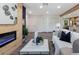 Living room features a wood accent wall with electric fireplace at 4629 26Th S Ave, St Petersburg, FL 33711