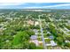 Aerial view of residential neighborhood, showcasing homes and lush green landscape at 6288 Airmont Dr, Spring Hill, FL 34606
