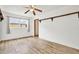 Simple bedroom with wood-look floors and built-in shelving at 6288 Airmont Dr, Spring Hill, FL 34606