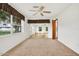 Bedroom with carpeted floors, large windows, and access to a sunroom at 6288 Airmont Dr, Spring Hill, FL 34606